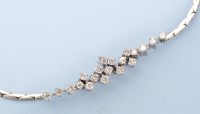 Lot 1192 - A diamond necklace, set with twenty brilliant...