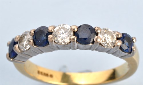 Lot 1220 - A sapphire and diamond half hoop eternity ring,...