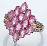 Lot 1227 - A pink sapphire and diamond ring, set with...