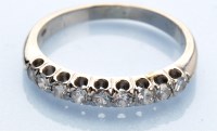 Lot 1235 - A nine stone diamond ring, the brilliant-cut...