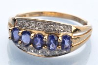 Lot 1237 - A tanzanite and diamond ring, the five oval...