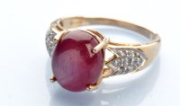 Lot 1239 - A synthetic star ruby and diamond ring, the...