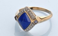 Lot 1242 - A lapis lazuli, diamond and sapphire ring, the...