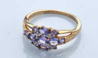 Lot 1244 - A tanzanite and diamond ring, the oval and...