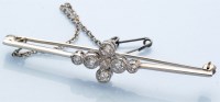 Lot 1246 - A late Victorian diamond bar brooch, set with...