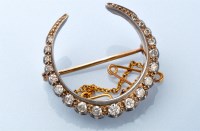 Lot 1249 - A Victorian diamond crescent form brooch, the...