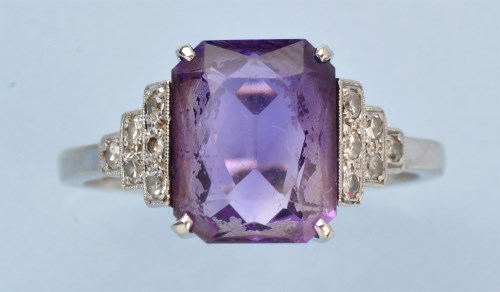 Lot 1250 - An Art Deco amethyst and diamond ring, the...