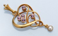 Lot 1253 - An Edwardian Art Nouveau pendant, set with...