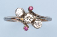 Lot 1258 - A diamond and ruby ring, the three graduated...