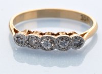 Lot 1260 - A five stone diamond ring, the graduated eight-...