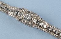 Lot 1266 - A diamond set bracelet, the central...