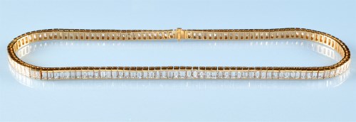 Lot 1268 - A diamond line necklace, the graduated...