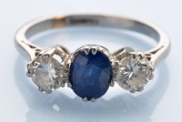 Lot 1277 - A sapphire and diamond ring, the oval...