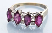 Lot 1297 - A ruby and diamond ring, the four marquise cut...