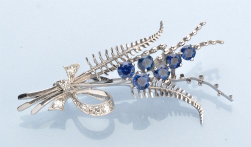 Lot 1298 - A sapphire and diamond brooch, in bouquet...