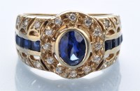 Lot 1301 - A sapphire and white sapphire dress ring, the...