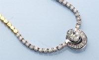 Lot 1310 - A diamond necklace, centred by an oval...