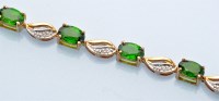 Lot 1311 - A green tourmaline and diamond bracelet, set...