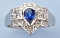 Lot 1312 - A sapphire and diamond ring, the pear-cut...