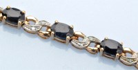 Lot 1313 - A sapphire and diamond bracelet, set with...