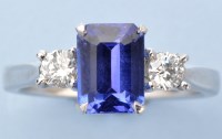 Lot 1316 - A tanzanite and diamond ring, the emerald-cut...
