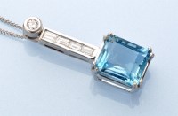 Lot 1318 - An aquamarine and diamond pendant, the emerald-...
