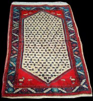 Lot 1348 - A Brojerd rug, the buff coloured medallion...