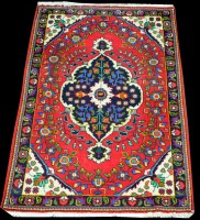 Lot 1351 - A Tabriz style rug, the lozenge shaped...