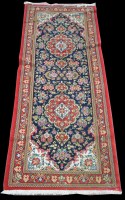 Lot 1358 - A Kashan runner, the two lozenge shaped...