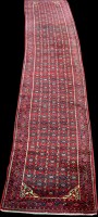 Lot 1361 - A Sarough runner, the red ground decorated...