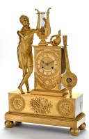 Lot 1368 - *An Empire gilt bronze mantel clock, with...