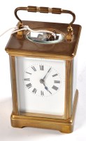 Lot 1384 - A late 19th Century brass based carriage clock,...
