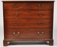 Lot 1400 - A late Georgian mahogany chest of two short...