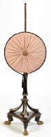 Lot 1407 - *A Regency ebonised pole screen, with circular...