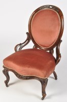 Lot 1437 - A Victorian walnut balloon back easy chair,...