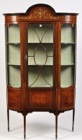 Lot 1438 - An Edwardian inlaid mahogany bowfront display...