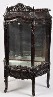 Lot 1441 - A Chinese carved hardwood display cabinet,...