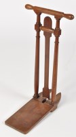 Lot 1443 - An early 19th Century mahogany boot jack, with...