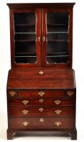 Lot 1448 - An early George III mahogany bureau bookcase,...