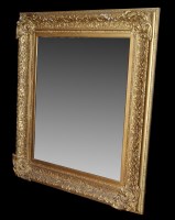 Lot 1460 - A large gold painted picture frame wall mirror,...