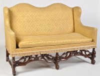 Lot 1464 - A Jacobean style settee, serpentine wing back...