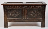 Lot 1467 - A 17th Century oak coffer, with panelled lid...