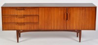 Lot 18 - A 1960's Danish style walnut sideboard, fitted...
