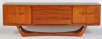 Lot 31 - G-Plan: a teak sideboard, fitted three short...