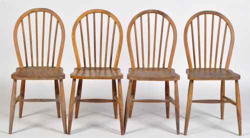 Lot 33 - Four Ercol elm and beech stick back dining...