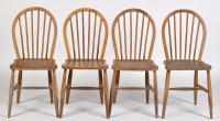 Lot 33 - Four Ercol elm and beech stick back dining...
