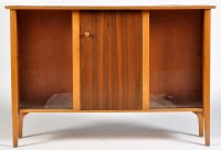 Lot 40 - A 1980's teak and walnut side cabinet, the...