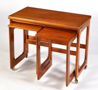 Lot 45 - A 1970's teak nest of three occasional tables,...