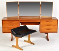 Lot 48 - A 1960's teak kneehole dressing table, with...