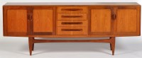 Lot 56 - Manner of G-Plan: a teak sideboard, fitted...